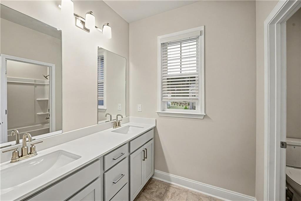 3068 Shirecrest Lane Dacula, GA 30019 - Photo 34 of 41 a bathroom with a sink double vanity and a mirror