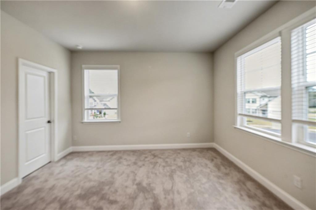 3068 Shirecrest Lane Dacula, GA 30019 - Photo 39 of 41 an empty room with windows