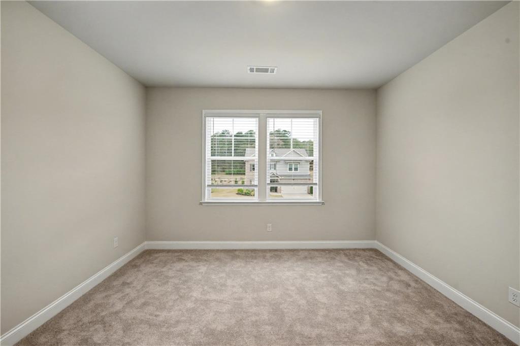 3068 Shirecrest Lane Dacula, GA 30019 - Photo 41 of 41 an empty room with a window