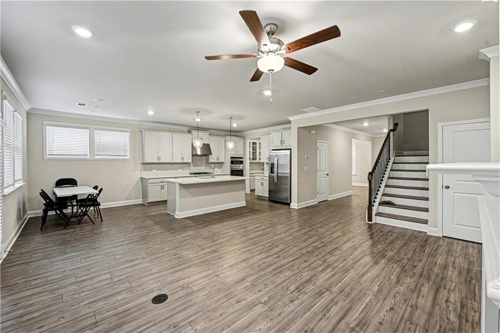 3068 Shirecrest Lane Dacula, GA 30019 - Photo 8 of 41 a view of kitchen with cabinets and wooden floor