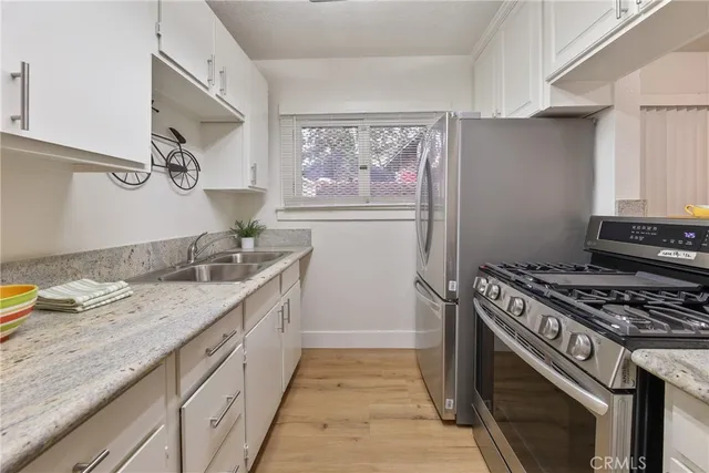 a kitchen with a stove and a sink