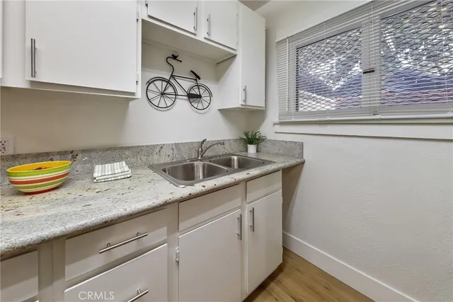a kitchen with a sink and a window