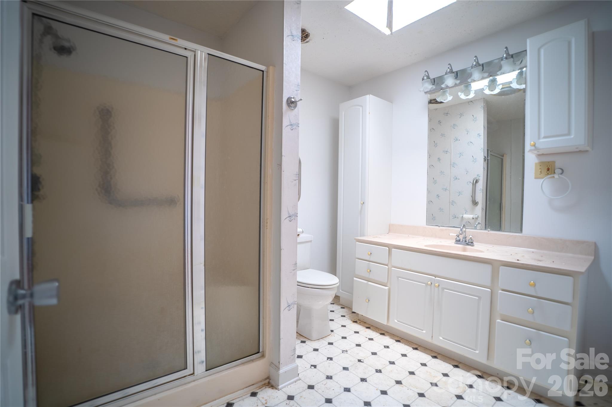 859 Stacy Hill Road Marion, NC 28752 - Photo 16 of 23 a spacious bathroom with a double vanity sink mirror and toilet