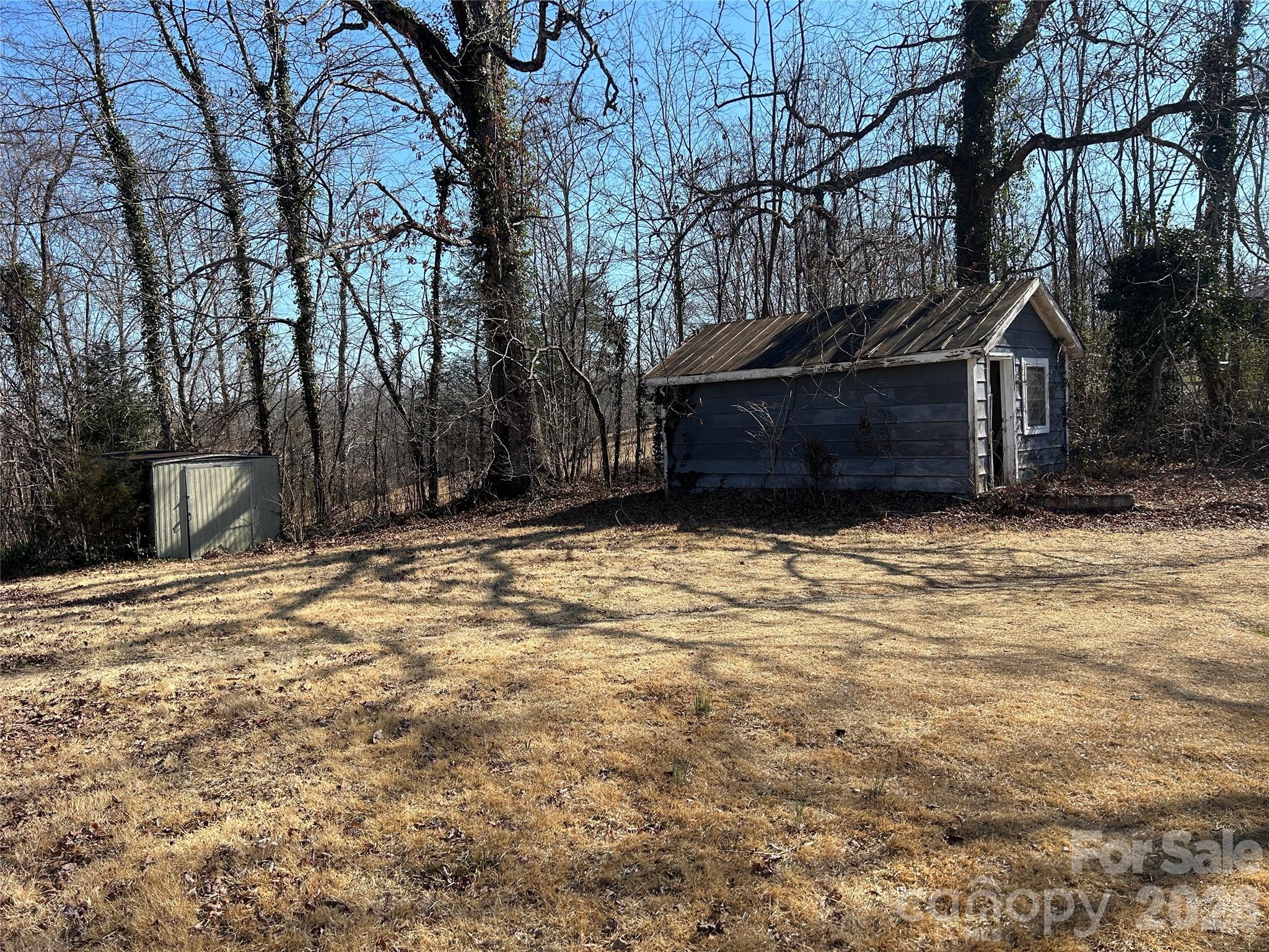 859 Stacy Hill Road Marion, NC 28752 - Photo 19 of 23 a view of a house with a large tree in front of it