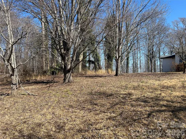 a view of yard covered with snow in front of house