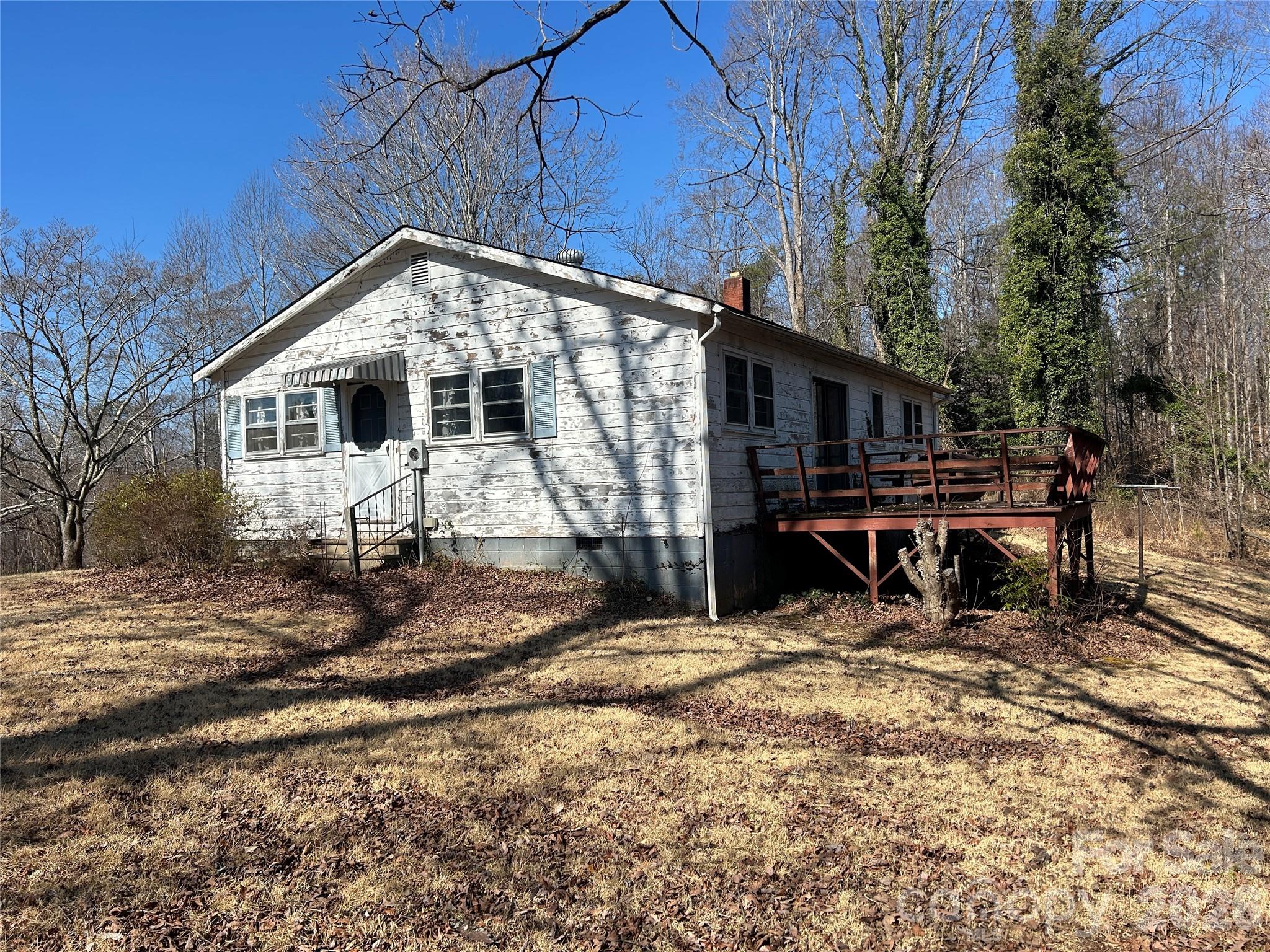 859 Stacy Hill Road Marion, NC 28752 - Photo 3 of 23 a front view of a house with a yard