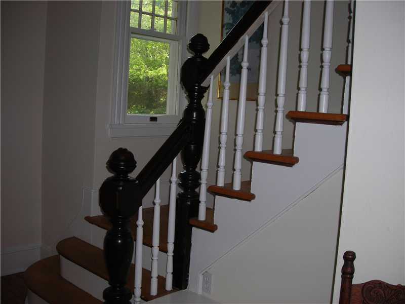 242 West Norwalk Road Norwalk, CT 06850 - Photo 11 of 13 a view of entryway with wooden floor and stairs