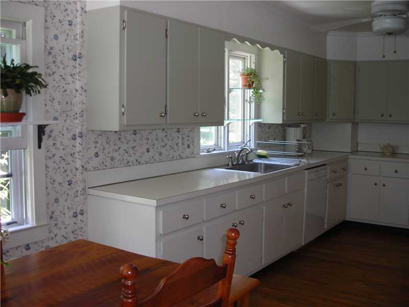 242 West Norwalk Road Norwalk, CT 06850 - Photo 9 of 13 a kitchen with stainless steel appliances granite countertop a sink stove and cabinets