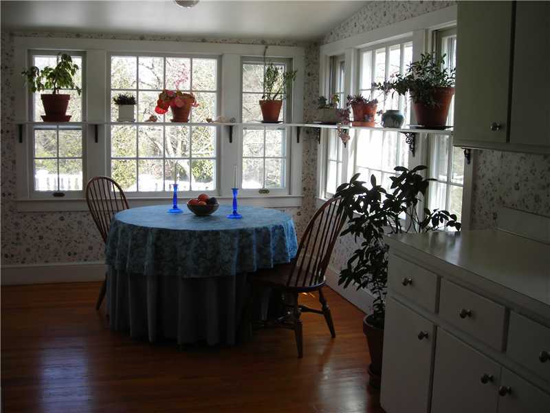 242 West Norwalk Road Norwalk, CT 06850 - Photo 10 of 13 a view of a dining room with furniture and wooden floor
