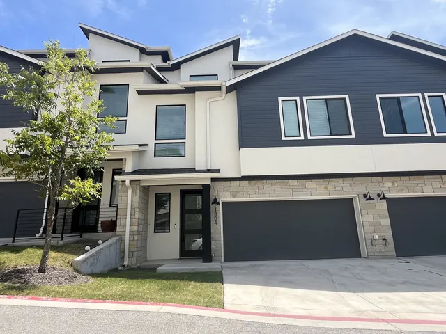a front view of a house with garage