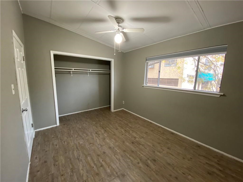 2413 Leon Street, Unit 101 Austin, TX 78705 - Photo 13 of 22 an empty room with windows and closet