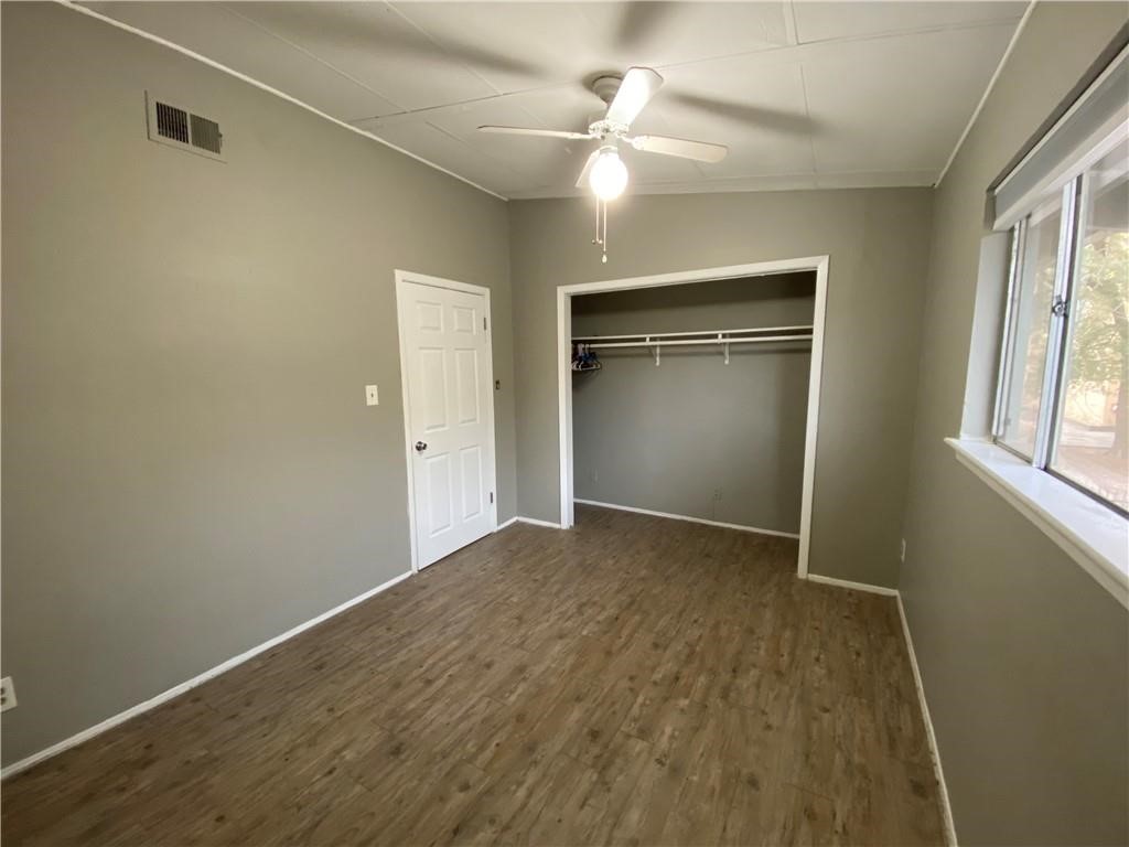 2413 Leon Street, Unit 101 Austin, TX 78705 - Photo 14 of 22 an empty room with windows and closet