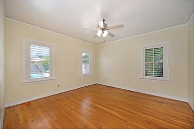 535 Myrtle Avenue Modesto, CA 95350 - Photo 18 of 42 a view of an empty room with a window and wooden floor