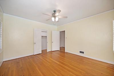 535 Myrtle Avenue Modesto, CA 95350 - Photo 19 of 42 a view of an empty room with chandelier fan and wooden floor