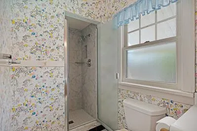 a bathroom with a shower and a sink