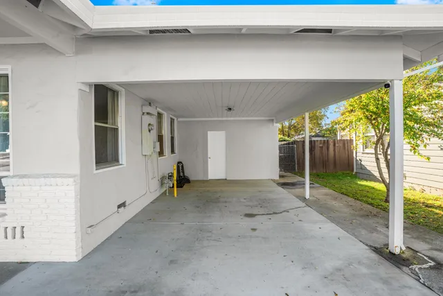 a view of empty room with floor to ceiling window