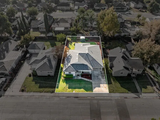 an aerial view of multiple houses with yard
