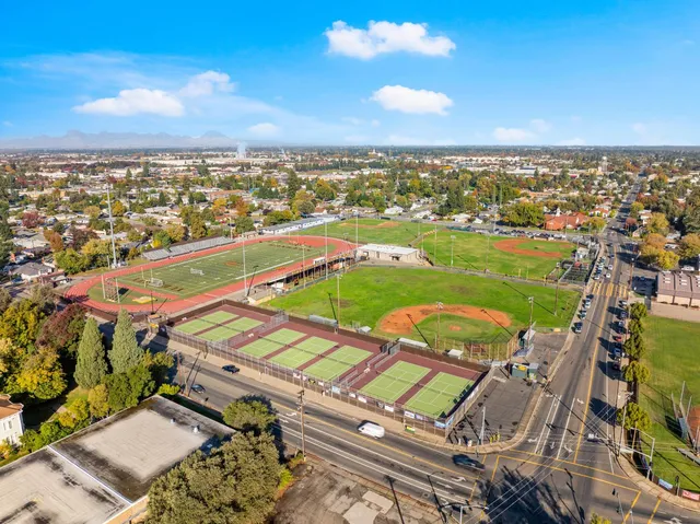 an aerial view of residential houses with outdoor space