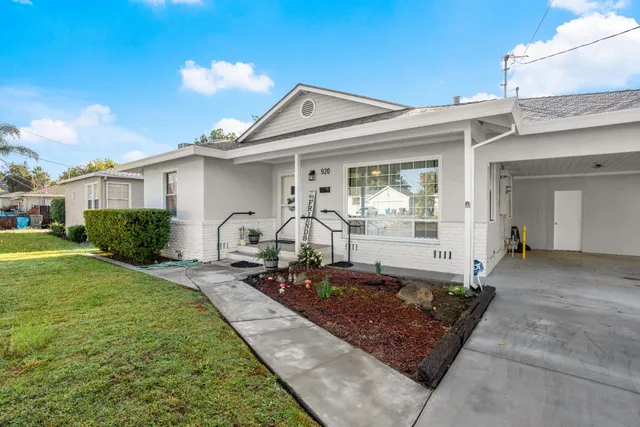 a front view of a house with garden