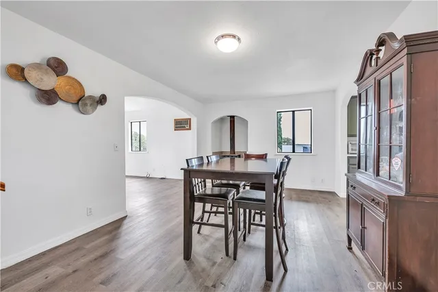 a kitchen with a sink cabinets stainless steel appliances and a window