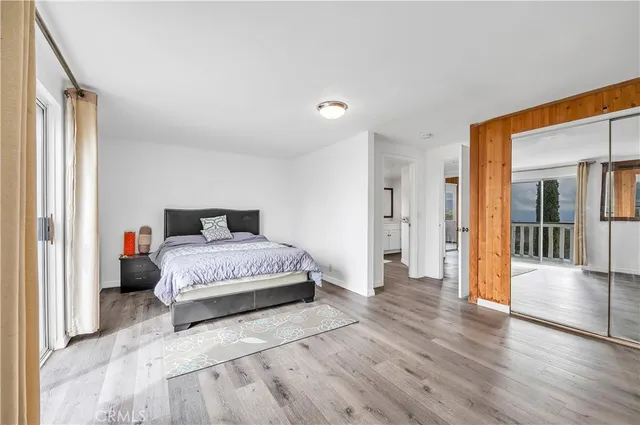 a bedroom with a bed and a tv