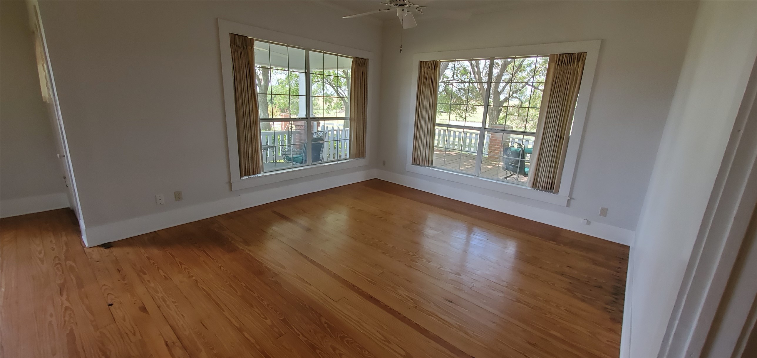 14808 Whitman Road Washington, TX 77880 - Photo 12 of 19 a view of an empty room with wooden floor and a window
