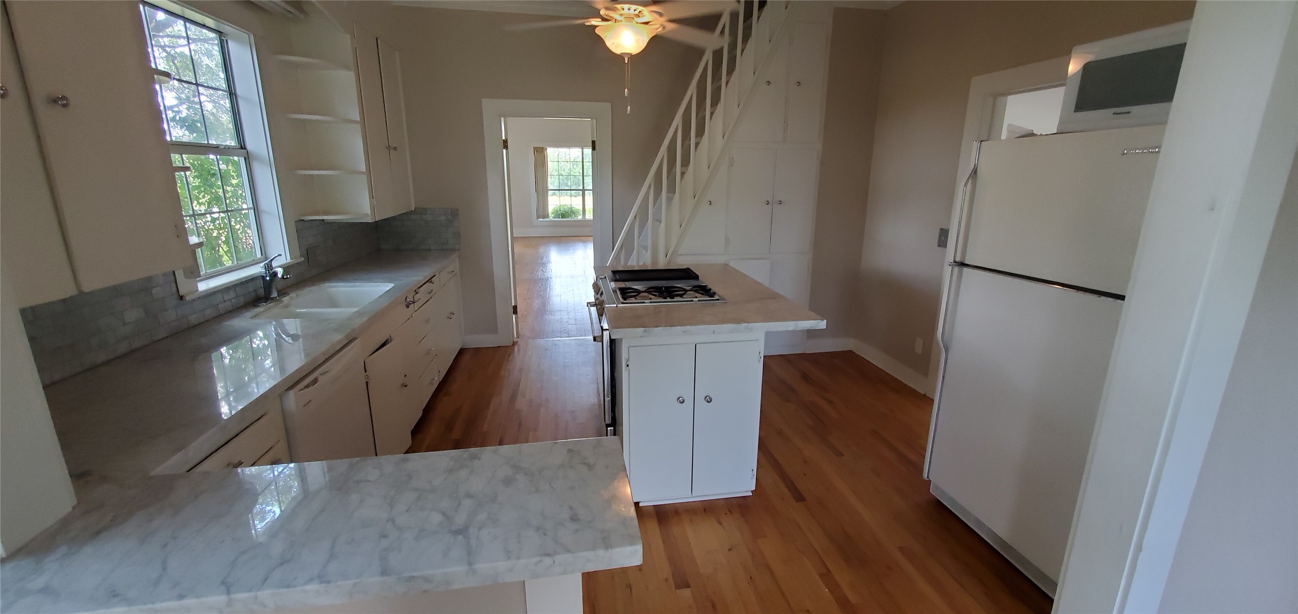 14808 Whitman Road Washington, TX 77880 - Photo 6 of 19 a kitchen with a sink stove and refrigerator