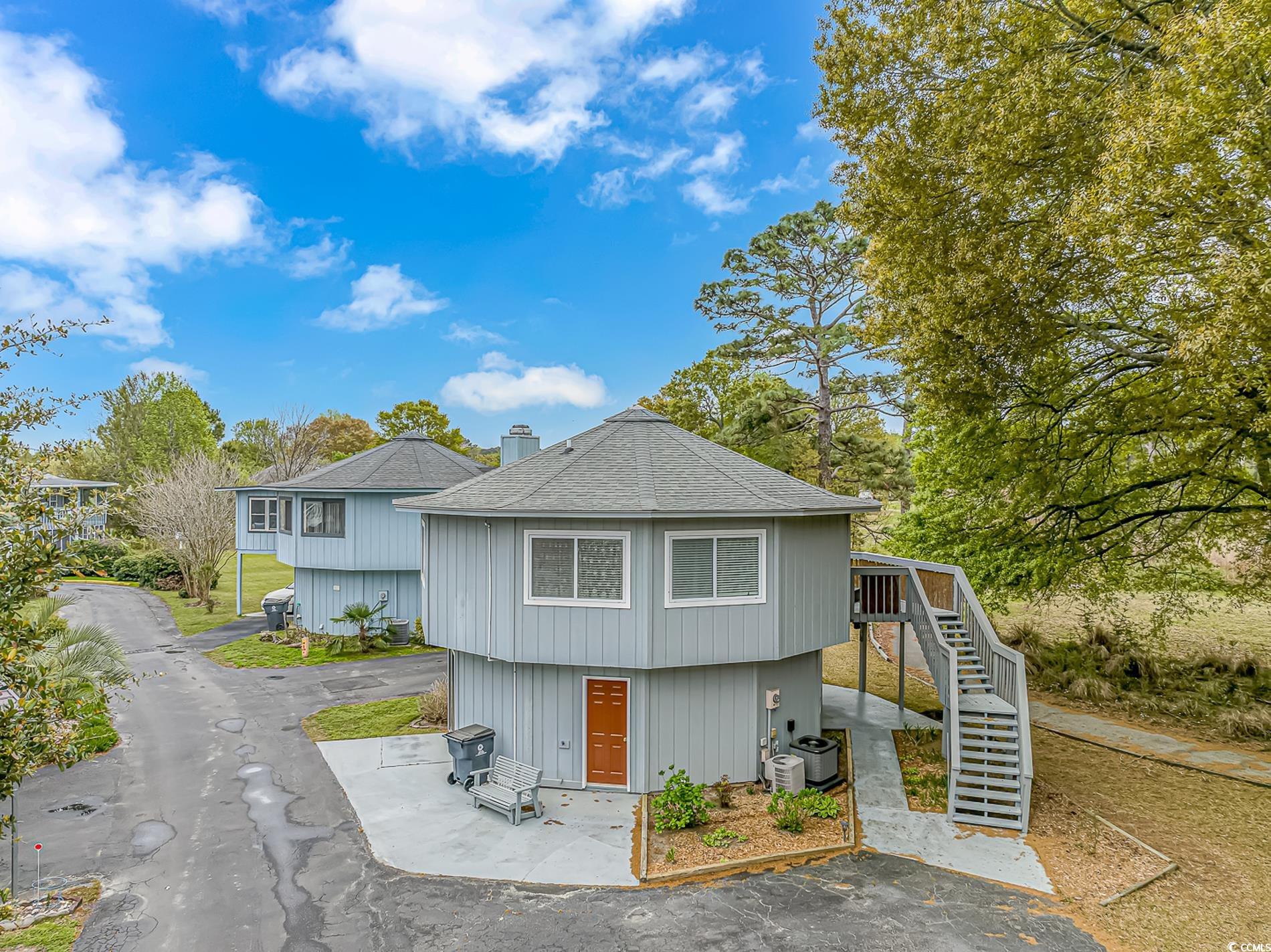 505 Tree Top Lane Myrtle Beach, SC 29588 - Photo 1 of 37 View of front of property with cooling unit, roof
