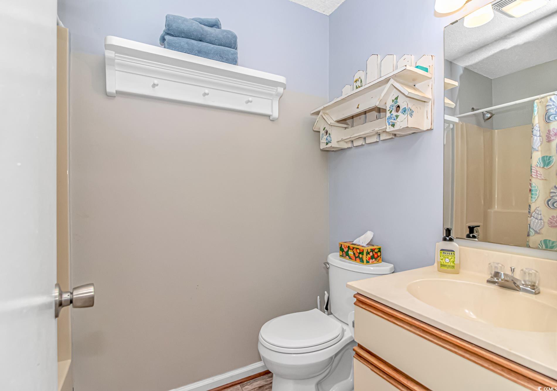 505 Tree Top Lane Myrtle Beach, SC 29588 - Photo 15 of 37 Full bath featuring visible vents, toilet, curtain