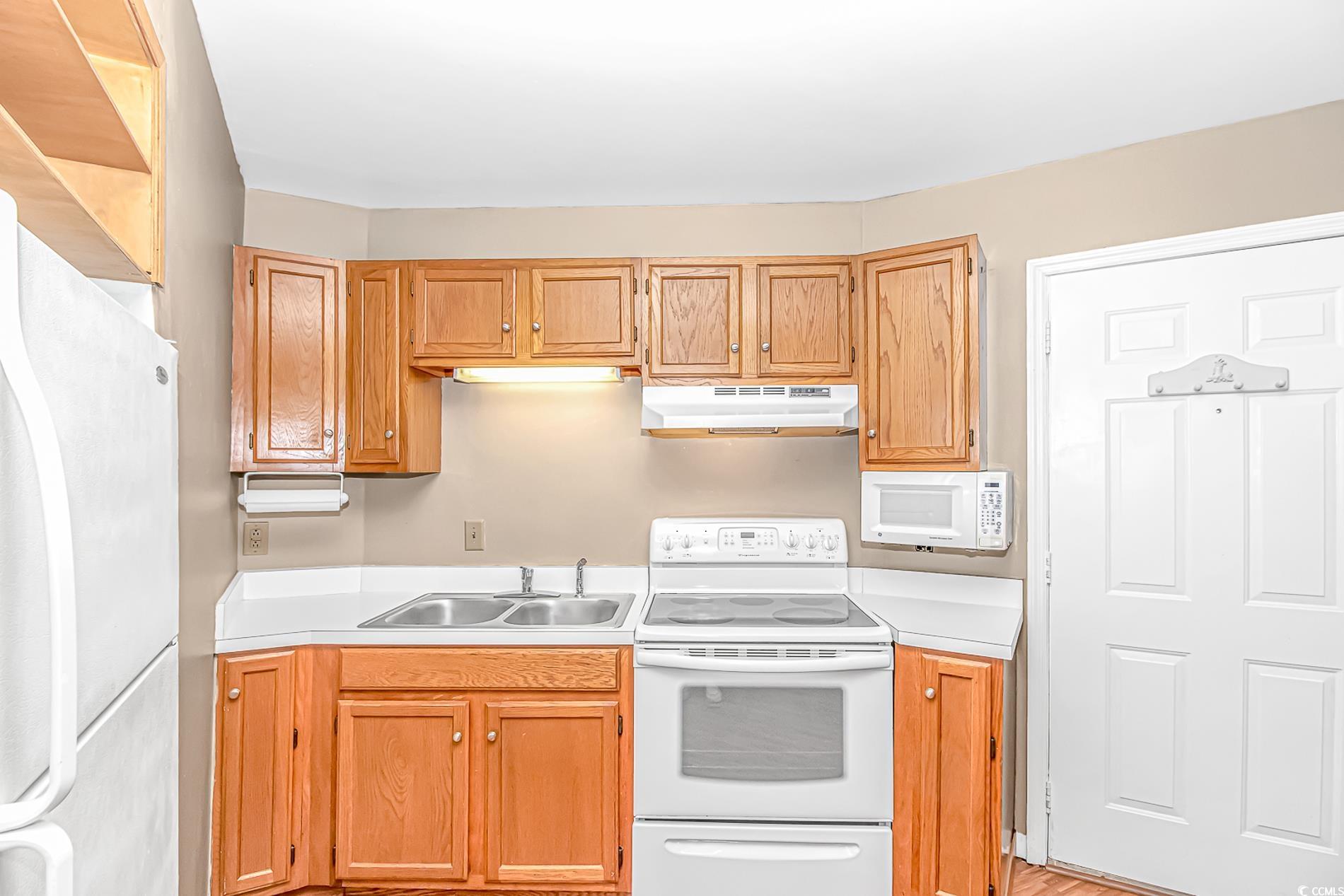 505 Tree Top Lane Myrtle Beach, SC 29588 - Photo 26 of 37 Kitchen with light countertops, under cabinet rang