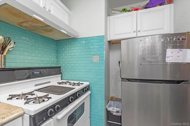 a kitchen with a stove and a refrigerator