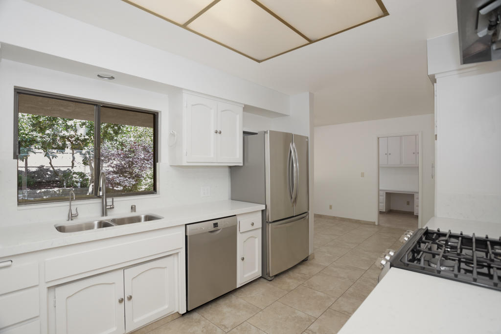 908 Vereda Del Ciervo Goleta, CA 93117 - Photo 12 of 35 a kitchen with a sink and cabinets
