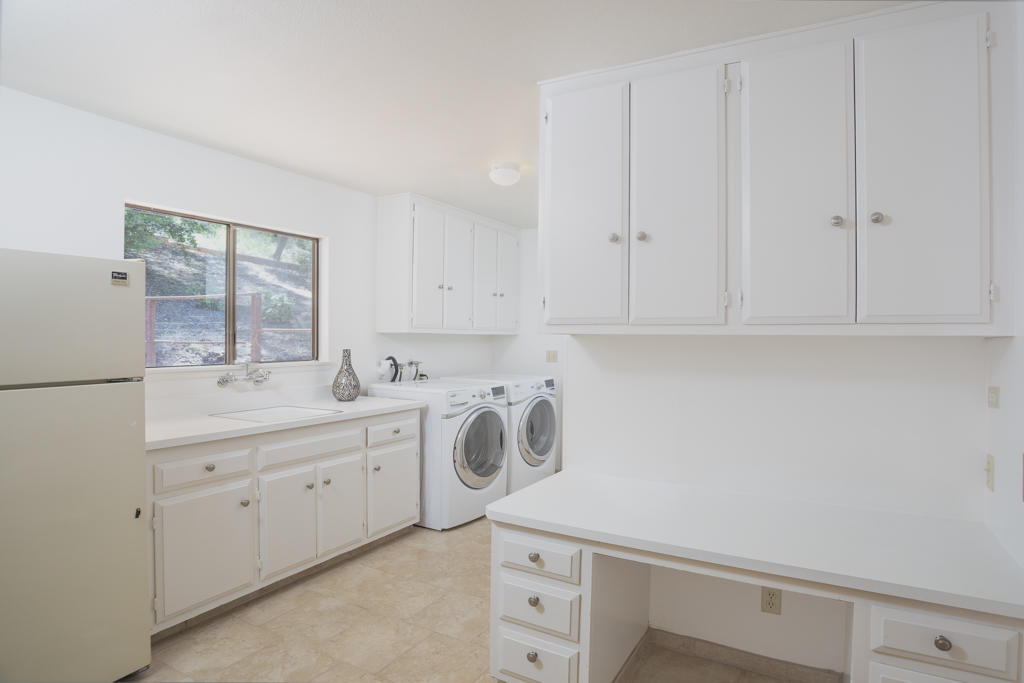 908 Vereda Del Ciervo Goleta, CA 93117 - Photo 17 of 35 a room with white cabinets and window