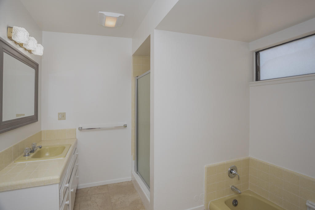 908 Vereda Del Ciervo Goleta, CA 93117 - Photo 21 of 35 a bathroom with a tub sink vanity and mirror