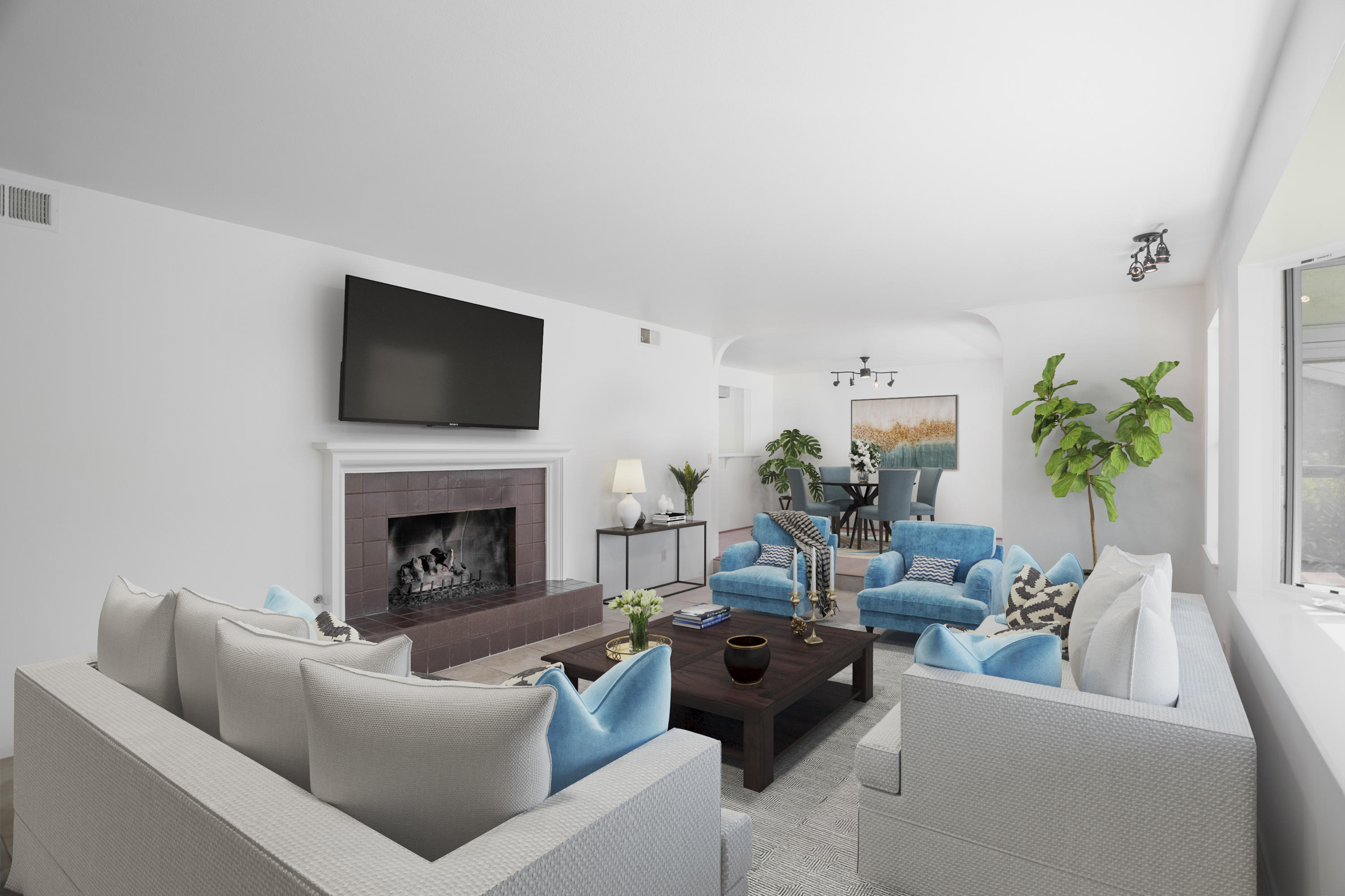 908 Vereda Del Ciervo Goleta, CA 93117 - Photo 32 of 35 a living room with furniture a fireplace and a flat screen tv