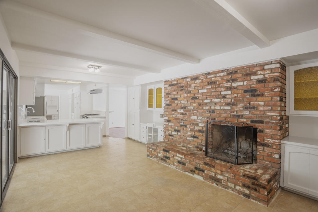 908 Vereda Del Ciervo Goleta, CA 93117 - Photo 10 of 35 a living room with furniture and a fireplace