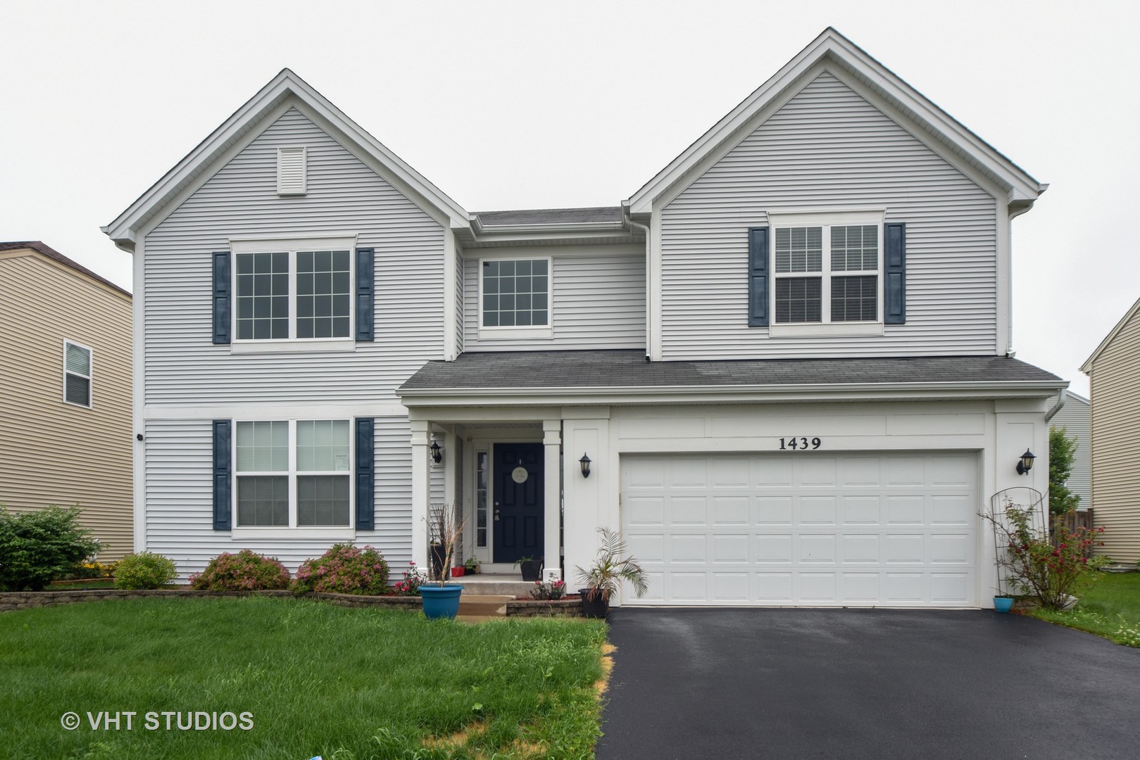 1439 Viola Lane Volo, IL 60073 - Photo 1 of 10 a front view of a house with a yard and garage