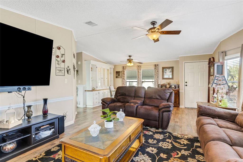 70 Mockingbird Lane Ellenton, FL 34222 - Photo 30 of 67 a living room with furniture and a flat screen tv