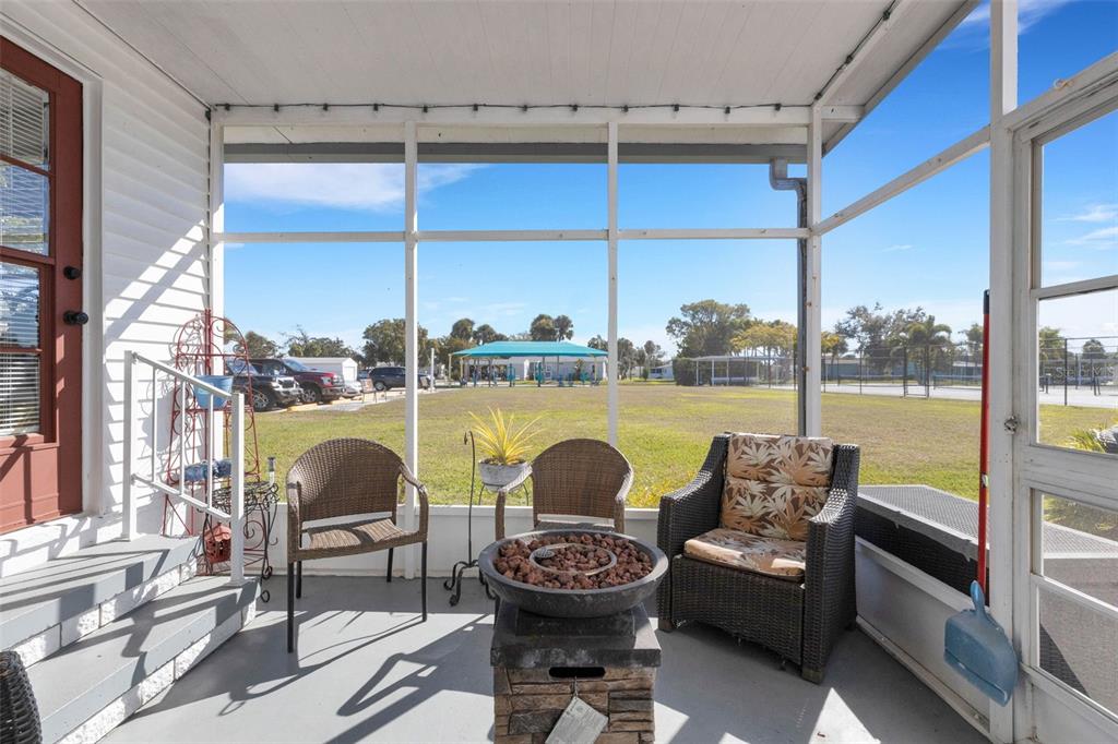 70 Mockingbird Lane Ellenton, FL 34222 - Photo 36 of 67 a living room with furniture and a floor to ceiling window