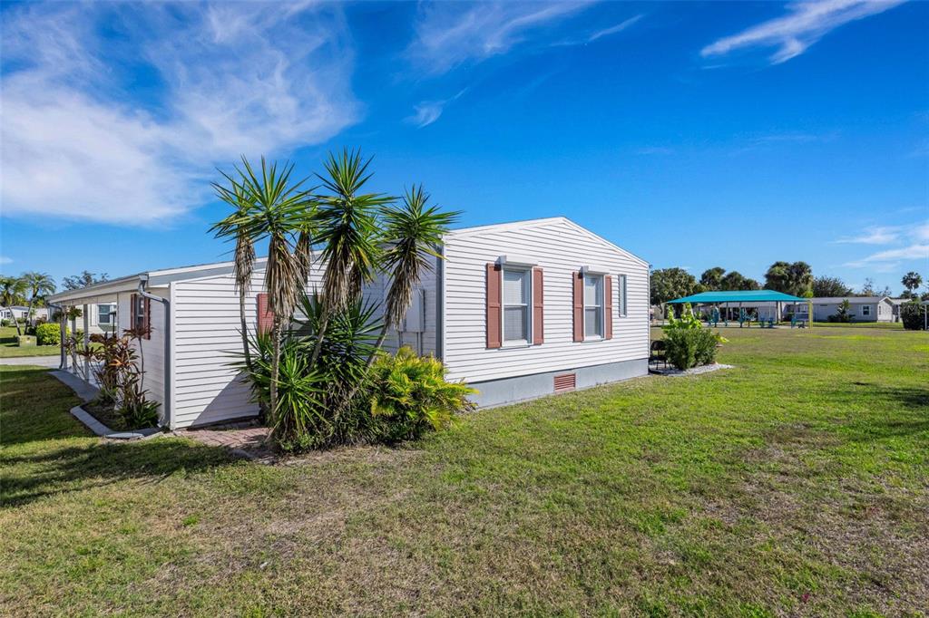 70 Mockingbird Lane Ellenton, FL 34222 - Photo 42 of 67 a front view of a house with garden