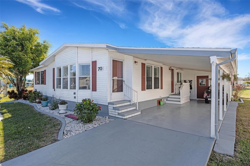 70 Mockingbird Lane Ellenton, FL 34222 - Photo 43 of 67 a front view of a house with a garden