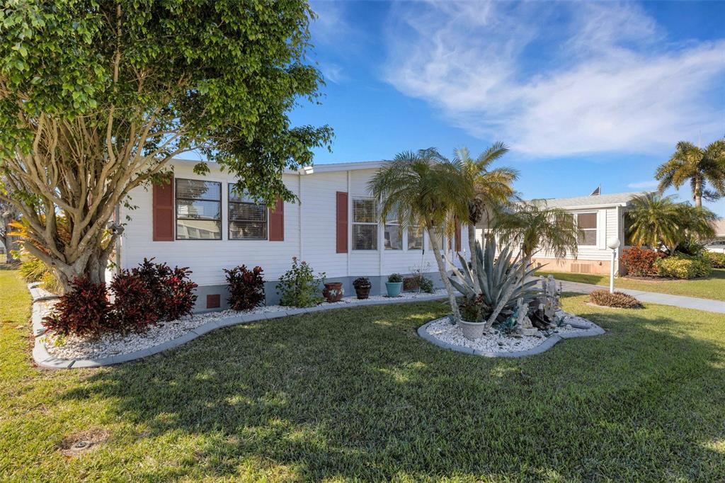 70 Mockingbird Lane Ellenton, FL 34222 - Photo 45 of 67 a house view with a garden space