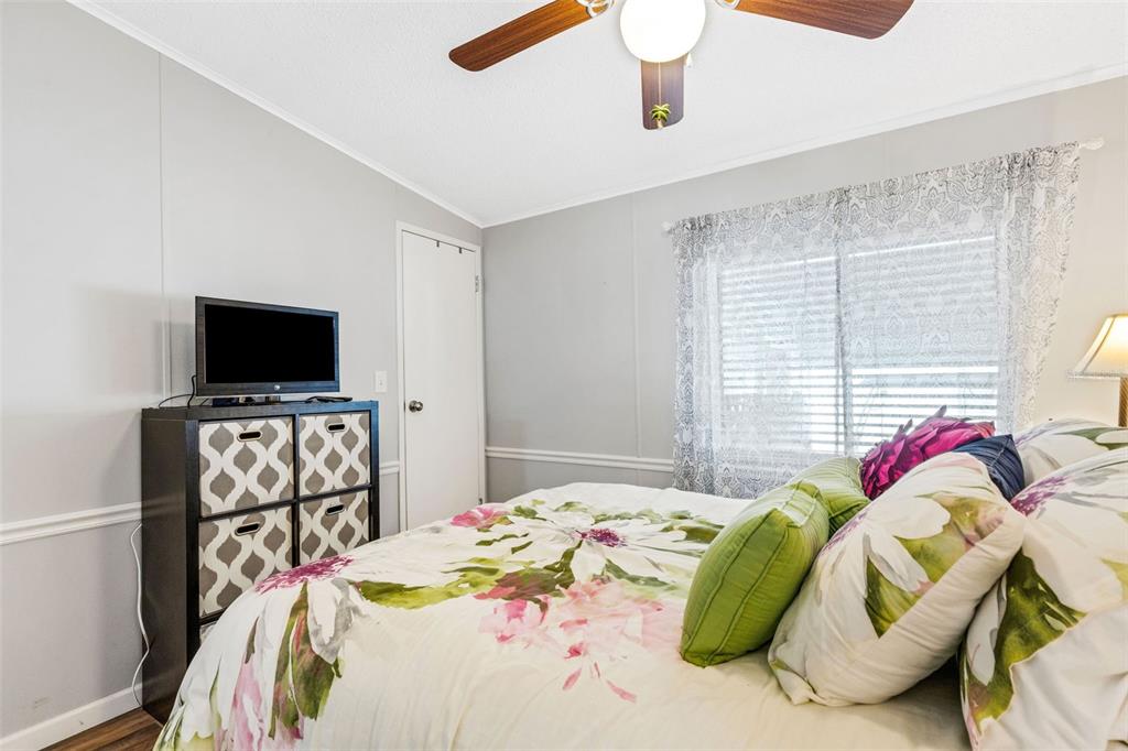 70 Mockingbird Lane Ellenton, FL 34222 - Photo 6 of 67 a bedroom with a bed and a flat screen tv