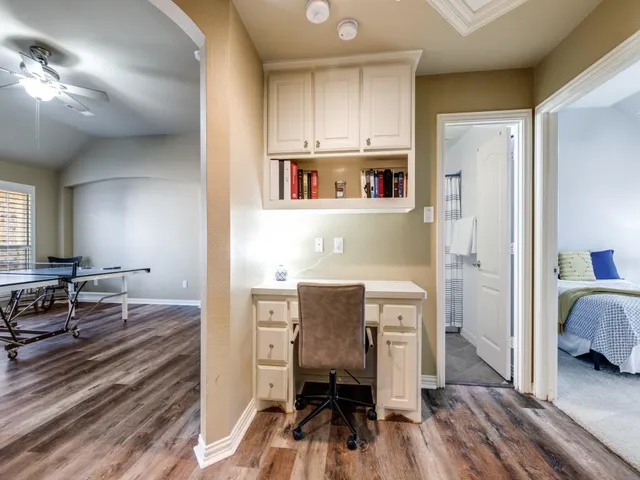 a view of kitchen center island wooden floor and living room