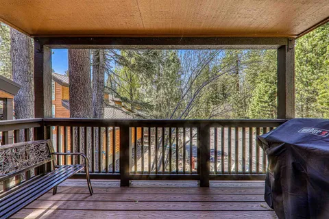 a view of a balcony with wooden floor