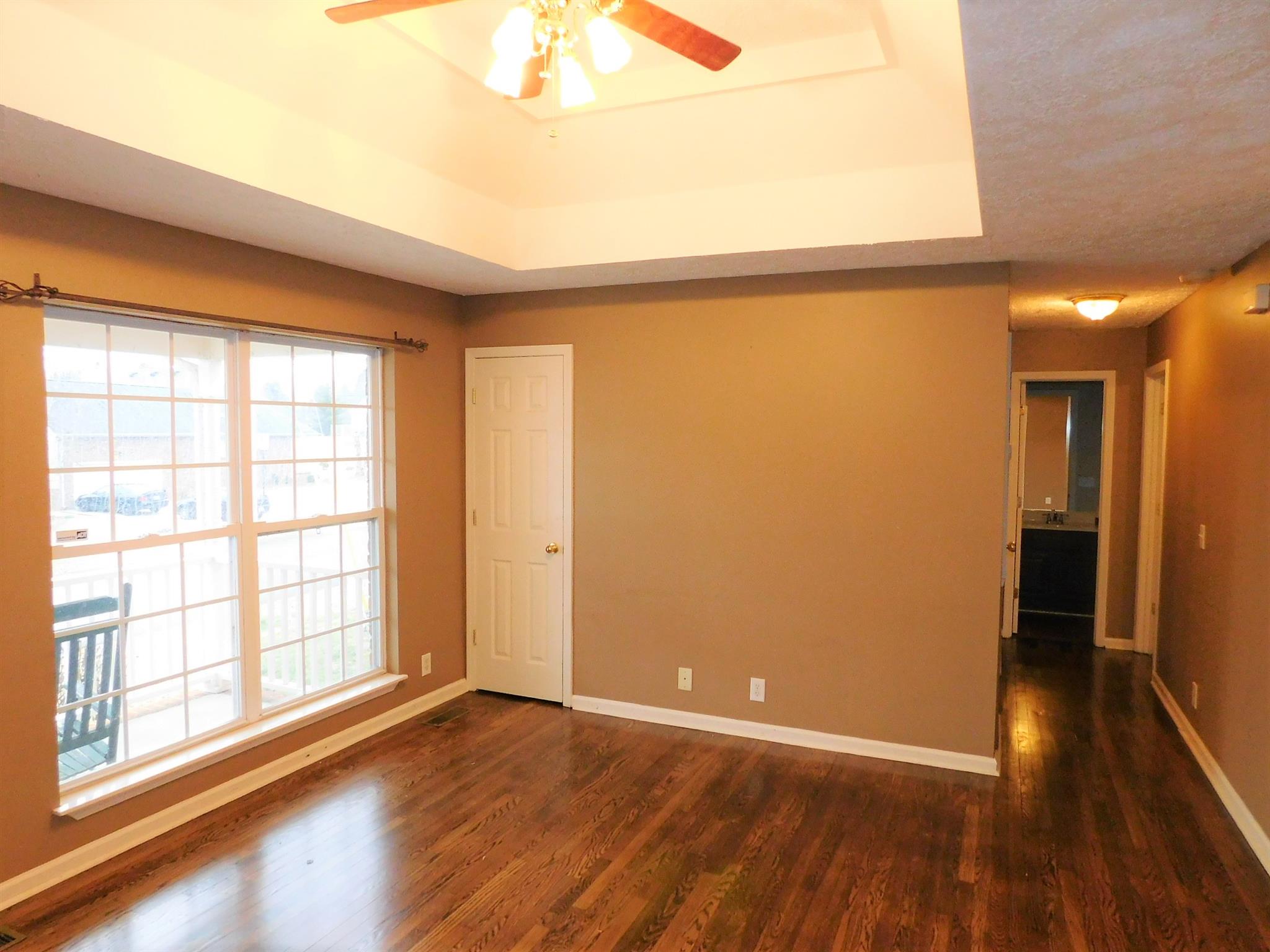 803 Marvin Layne Road Mount Juliet, TN 37122 - Photo 3 of 18 wooden floor in an empty room with a window