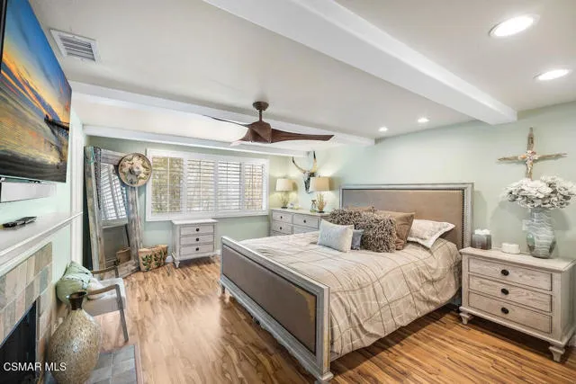 a bedroom with a large bed and a window