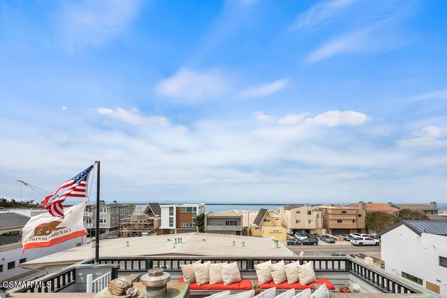 a view of a balcony with an outdoor seating