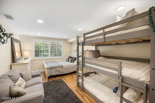 a bedroom with furniture and a window