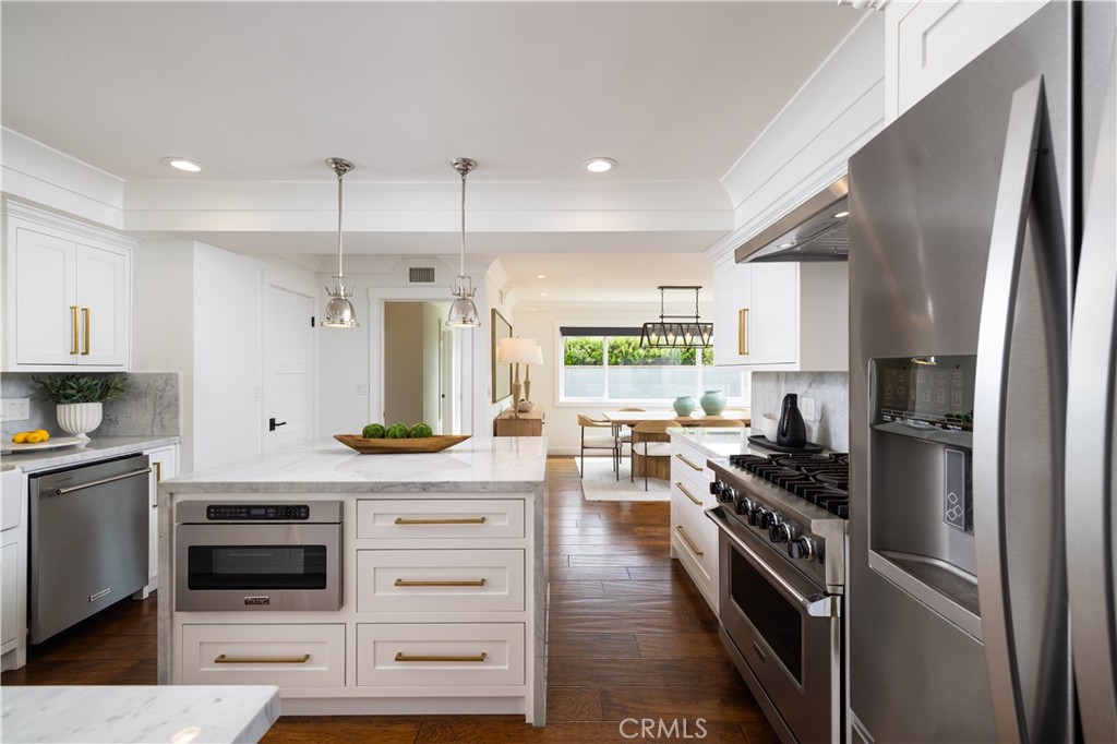 1609 Ruth Lane Newport Beach, CA 92660 - Photo 14 of 39 a kitchen with stainless steel appliances a stove a sink and a refrigerator